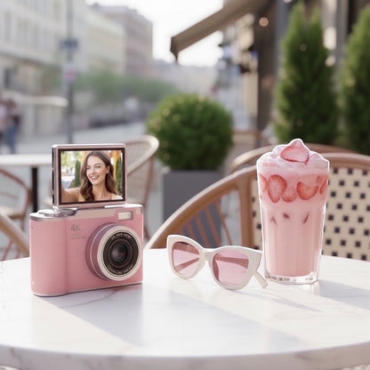 Pixie 4K digital camera in pink with a flip screen, perfect for selfies and travel.