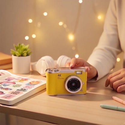 Pixie 4K digital camera in bright yellow with a silver top, featuring a flip screen and 4K resolution. Ideal for selfies and travel.